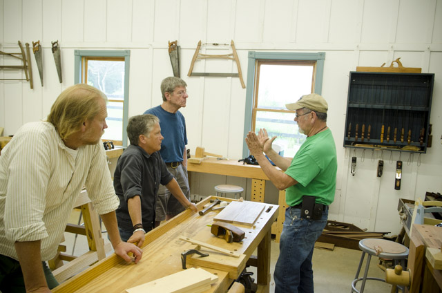 David Ray Pine teaching woodworking class students how hand plane a board with a coffin smoothing plane 