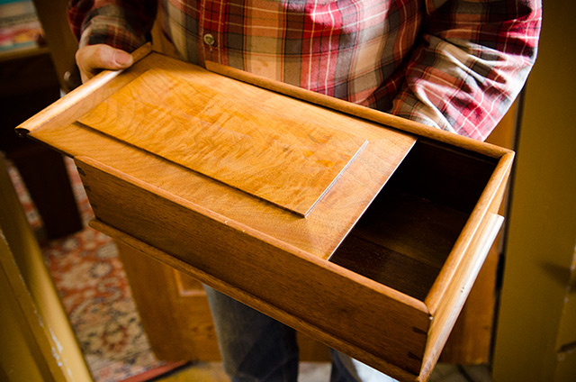 David Ray Pine sliding open the raised panel lid of a Moravian Candlebox