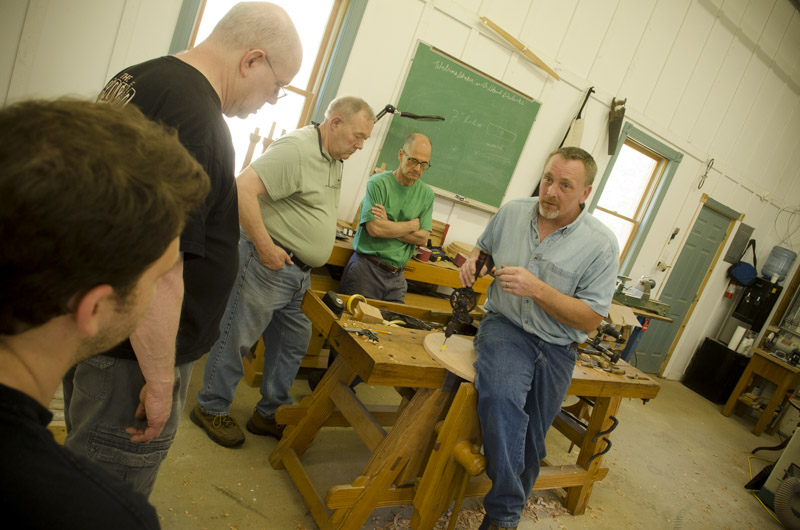 Will Myers teaching a group of students how to make a Hancock Shaker Candle Stand table at Joshua Farnsworth's Wood And Shop Woodworking School