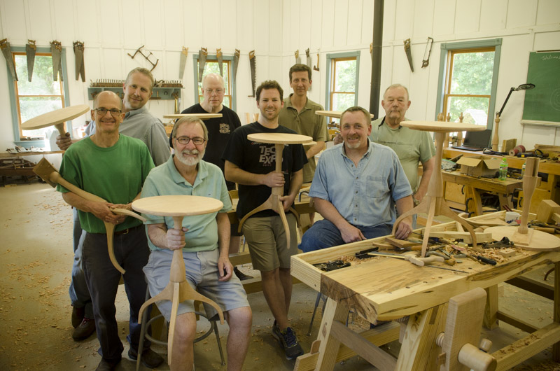 a group of woodworking students showing their finished hancock shaker candle stands with Will Myers and Joshua Farnsworth at the Wood And Shop Traditional Woodworking School