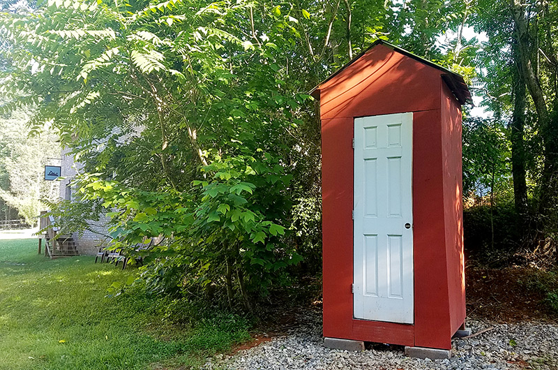 Red outhouse near the Wood and Shop Traditional woodworking school 