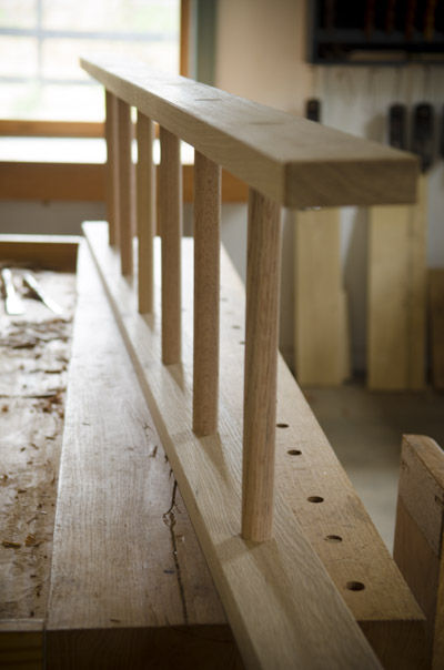 Wooden oak ladder on a woodworking workbench for ladder making class