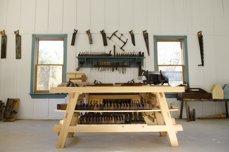 Portable Moravian workbench in the Wood and Shop Traditional Woodworking School with hand saws and hand planes