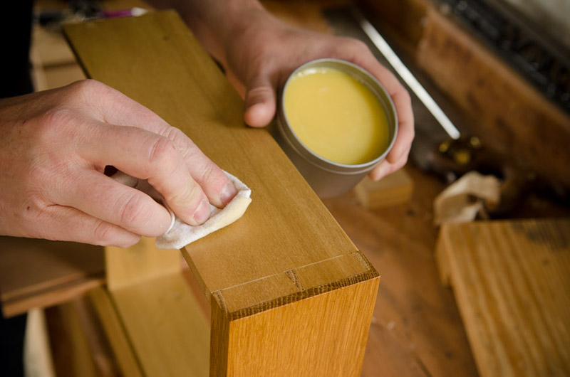 Wiping Beeswax Wood Finish on a dovetail drawer